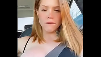 Redheaded Teenie Flaunts Her Assets While Driving